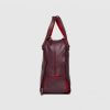 Maxi Tote in Deep Burgundy with shoe compartment. Side View